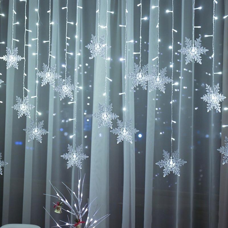 SnowGlow™ | LED Vorhang-Lichterkette mit Schneeflockenmotiv
