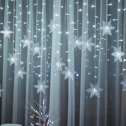 SnowGlow™ | LED Vorhang-Lichterkette mit Schneeflockenmotiv