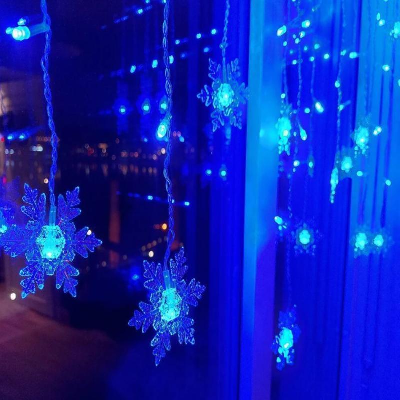 SnowGlow™ | LED Vorhang-Lichterkette mit Schneeflockenmotiv