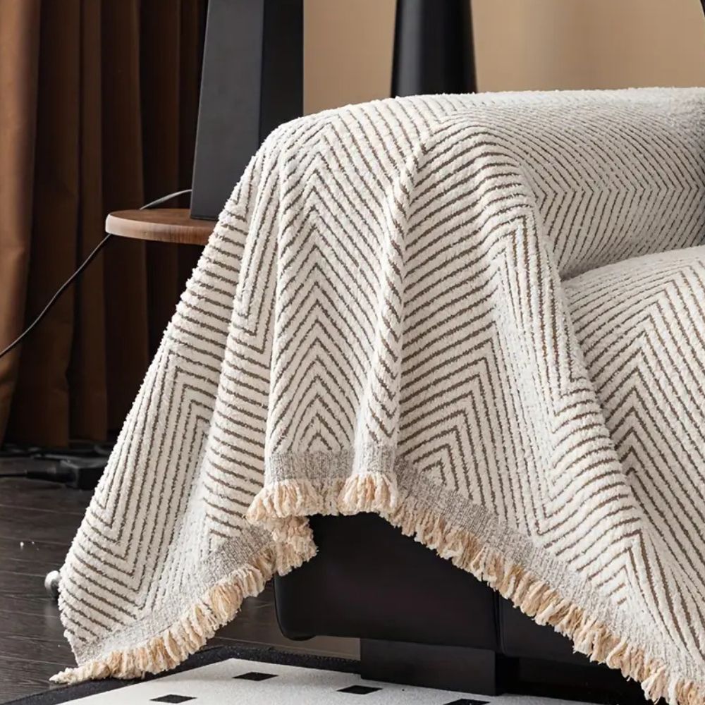 LumiWeave – Sofaschoner-Plaid im Fischgrätmuster