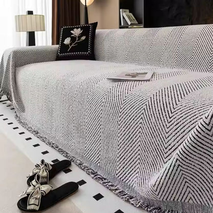 LumiWeave – Sofaschoner-Plaid im Fischgrätmuster