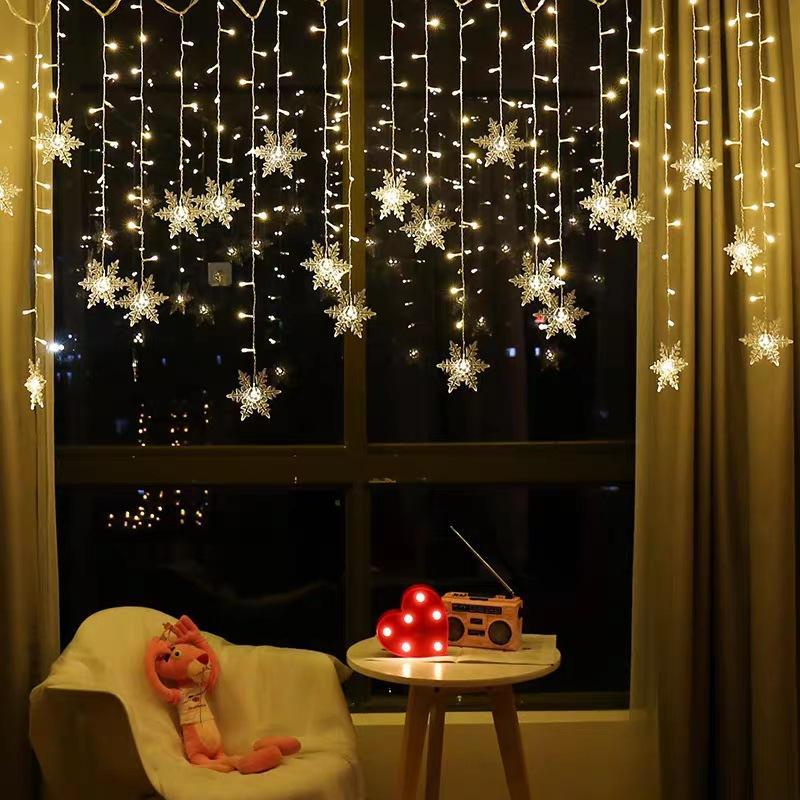 SnowGlow™ | LED Vorhang-Lichterkette mit Schneeflockenmotiv
