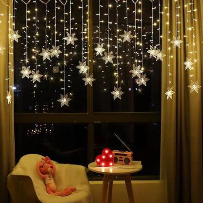 SnowGlow™ | LED Vorhang-Lichterkette mit Schneeflockenmotiv